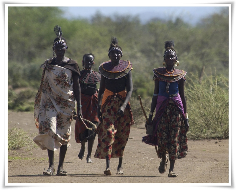 Pokot women trekking through the Kenya outback.